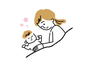 赤ちゃんを寝かしつけるママ